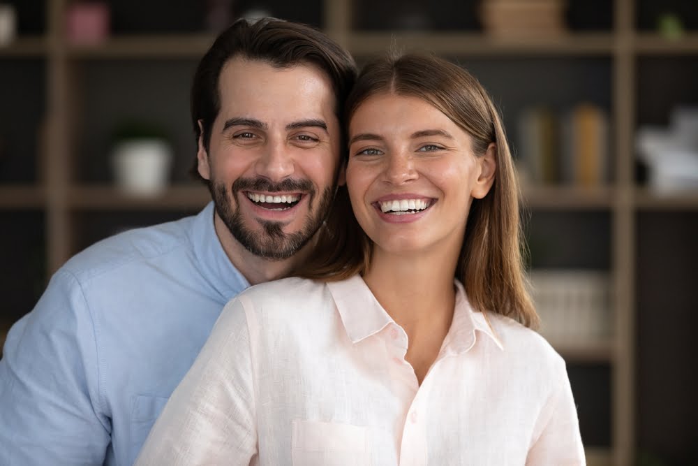 couple posing for a photograph - Restorative Dental