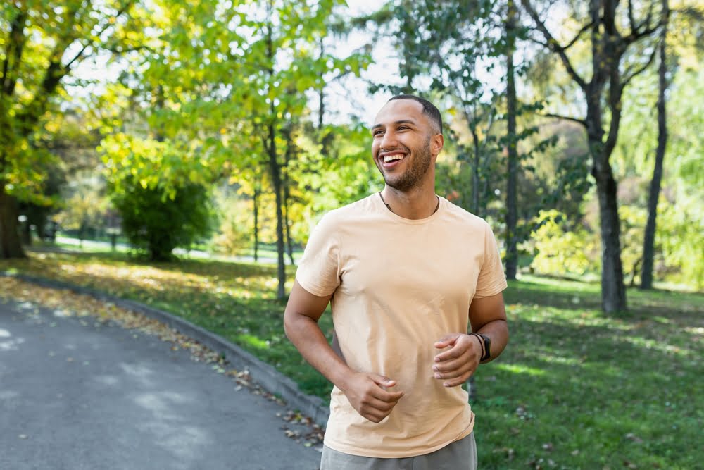 Smiling man having a run outdoors - Dental Bridge in Georgina, ON